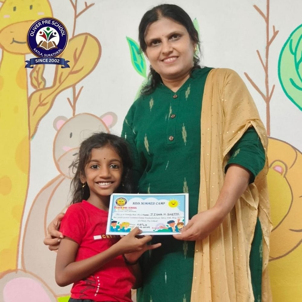 Young Girl receiving prize from Headmistress of Oliver Preschool Surathkal